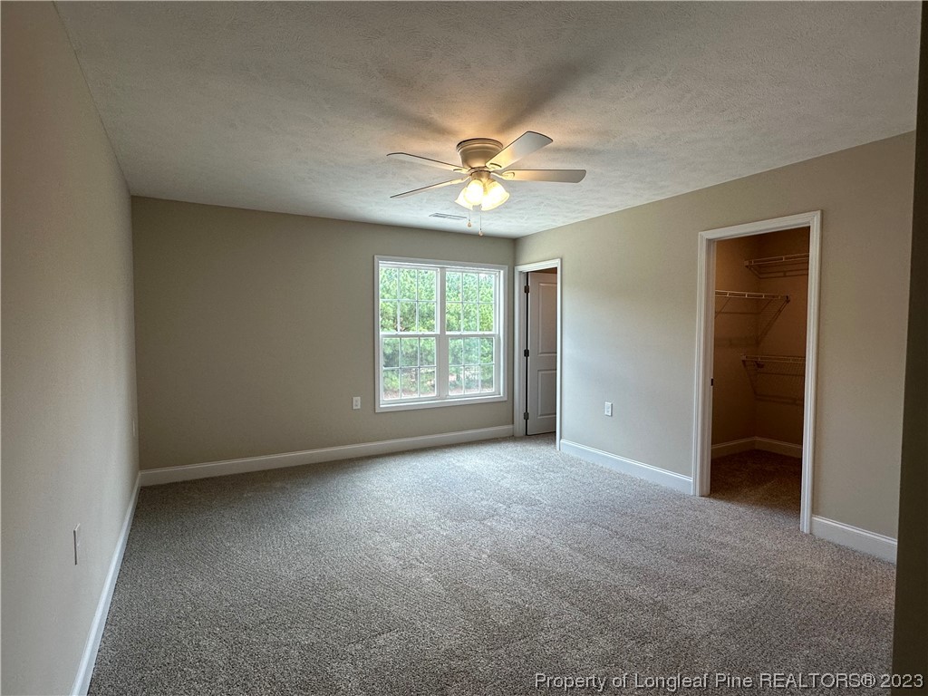 2526 Sand Hill Road Fayetteville, NC 28306 - Photo 26 of 40 an empty room with windows and fan