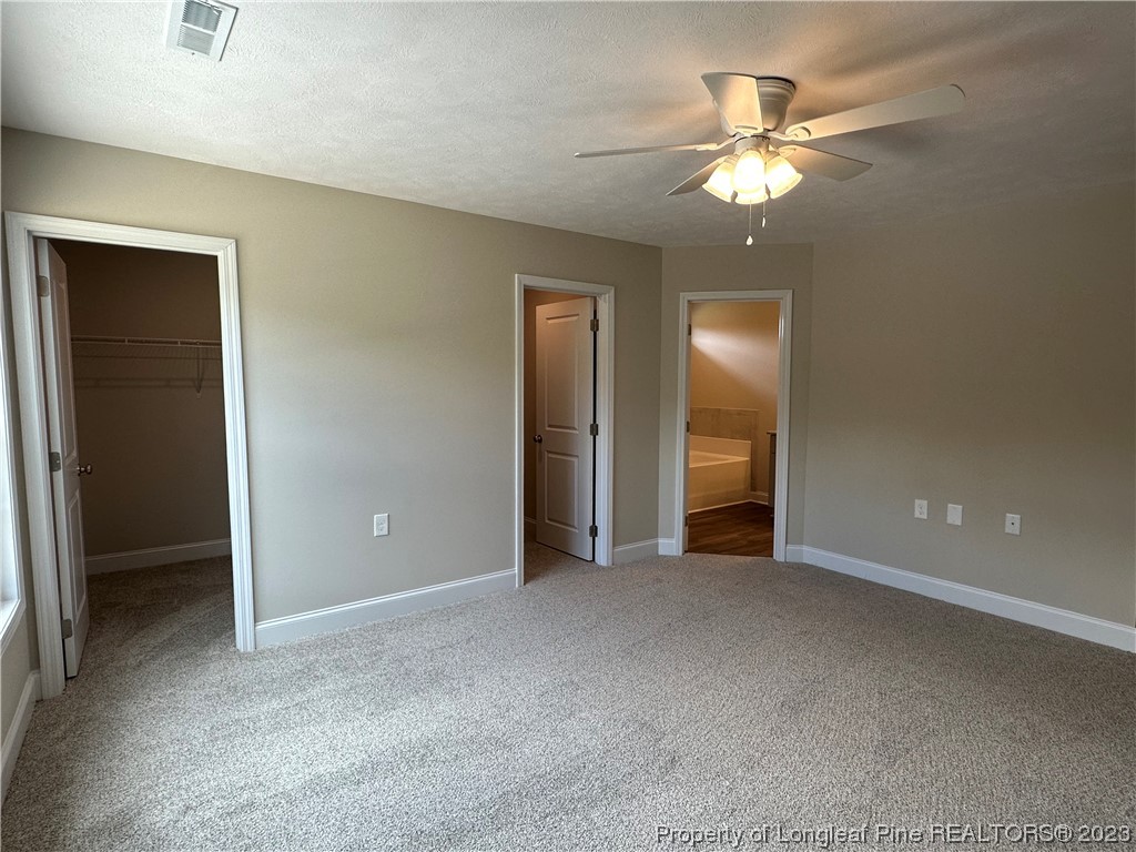 2526 Sand Hill Road Fayetteville, NC 28306 - Photo 28 of 40 a view of an empty room with a chandelier fan