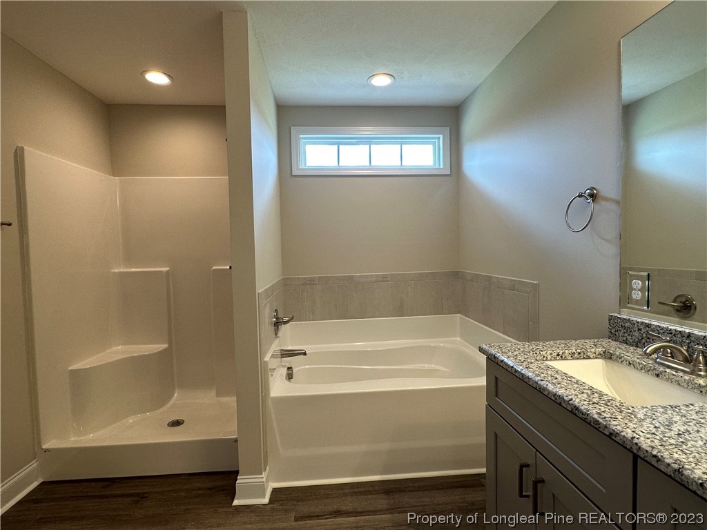 2526 Sand Hill Road Fayetteville, NC 28306 - Photo 30 of 40 a bathroom with a granite countertop sink a toilet and shower