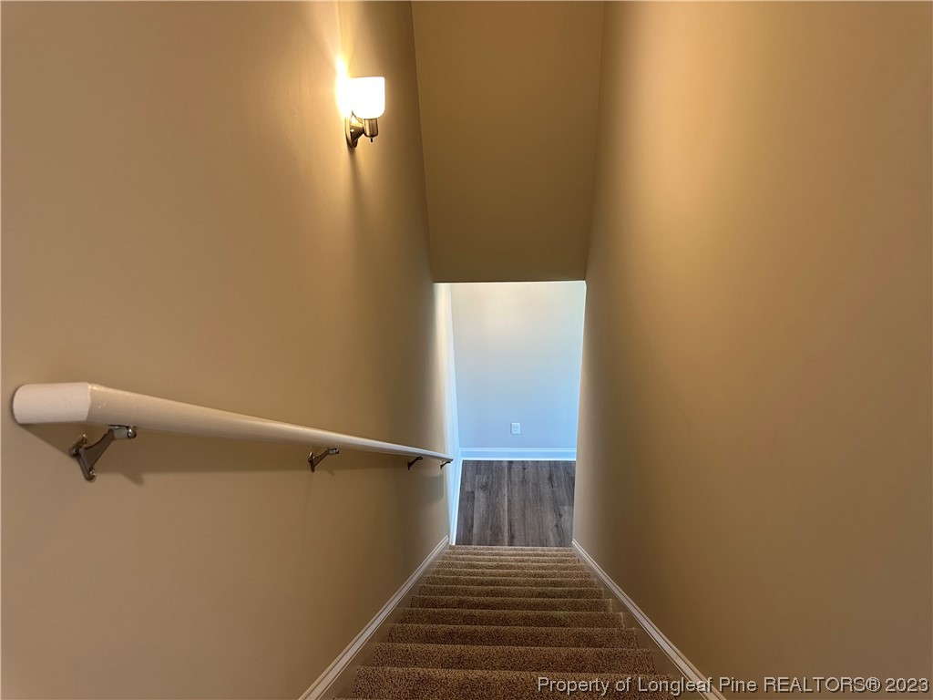 2526 Sand Hill Road Fayetteville, NC 28306 - Photo 33 of 40 a view of a hallway with wooden floor