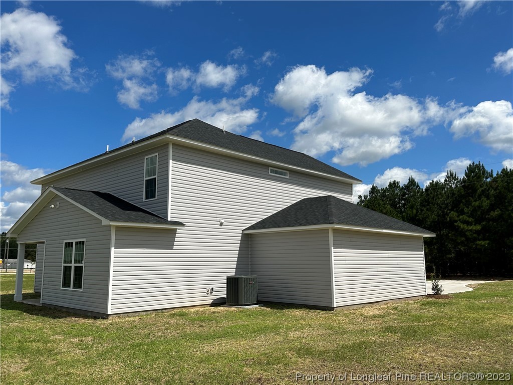 2526 Sand Hill Road Fayetteville, NC 28306 - Photo 39 of 40 a front view of house with yard and trees in the background