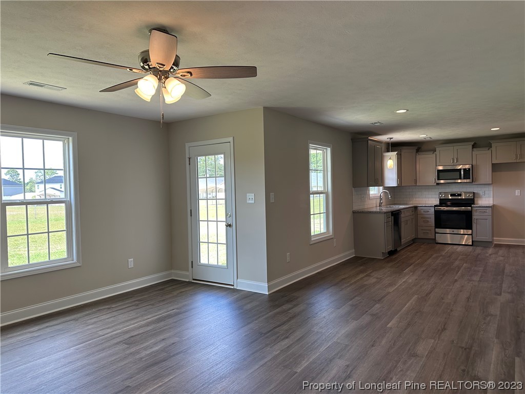 2526 Sand Hill Road Fayetteville, NC 28306 - Photo 10 of 40 a view of kitchen with cabinets and wooden floor