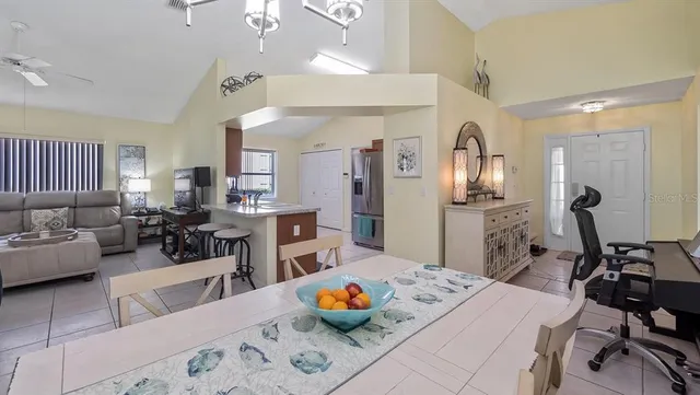 a living room with furniture and a table