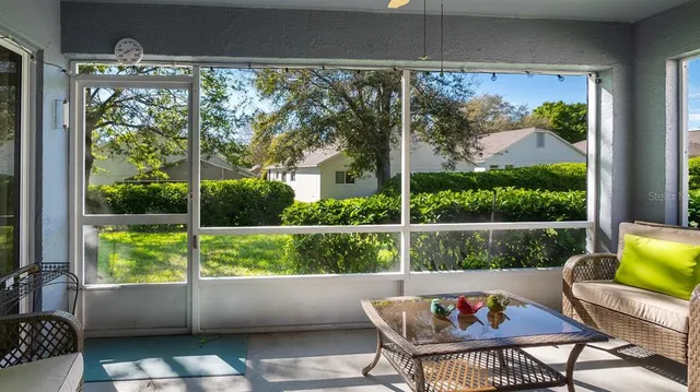a view of a chair and table in a patio