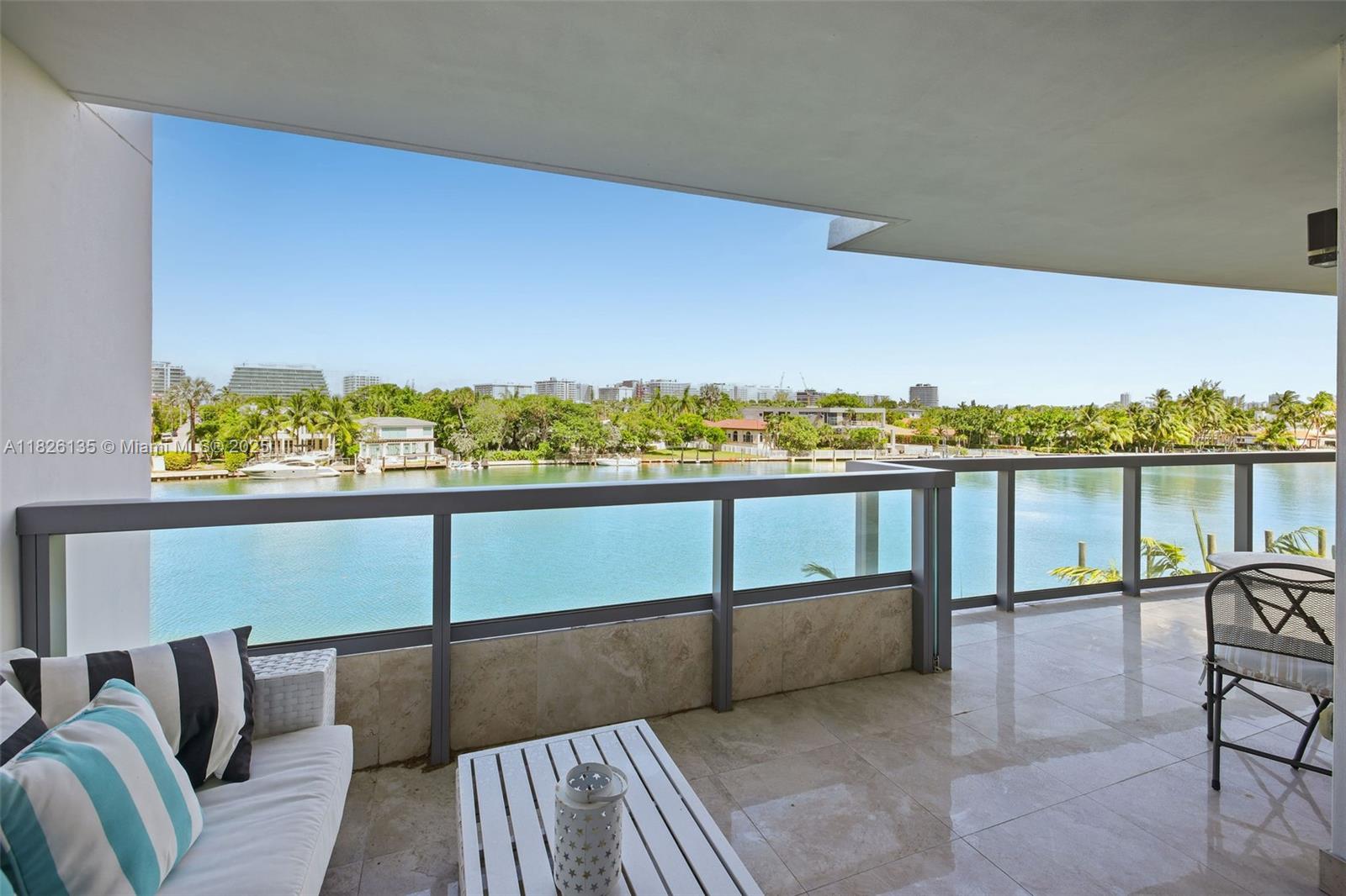 9261 East Bay Harbor Drive, Unit 404 Bay Harbor Islands, FL 33154 - Photo 11 of 49 a view of a chairs in a balcony