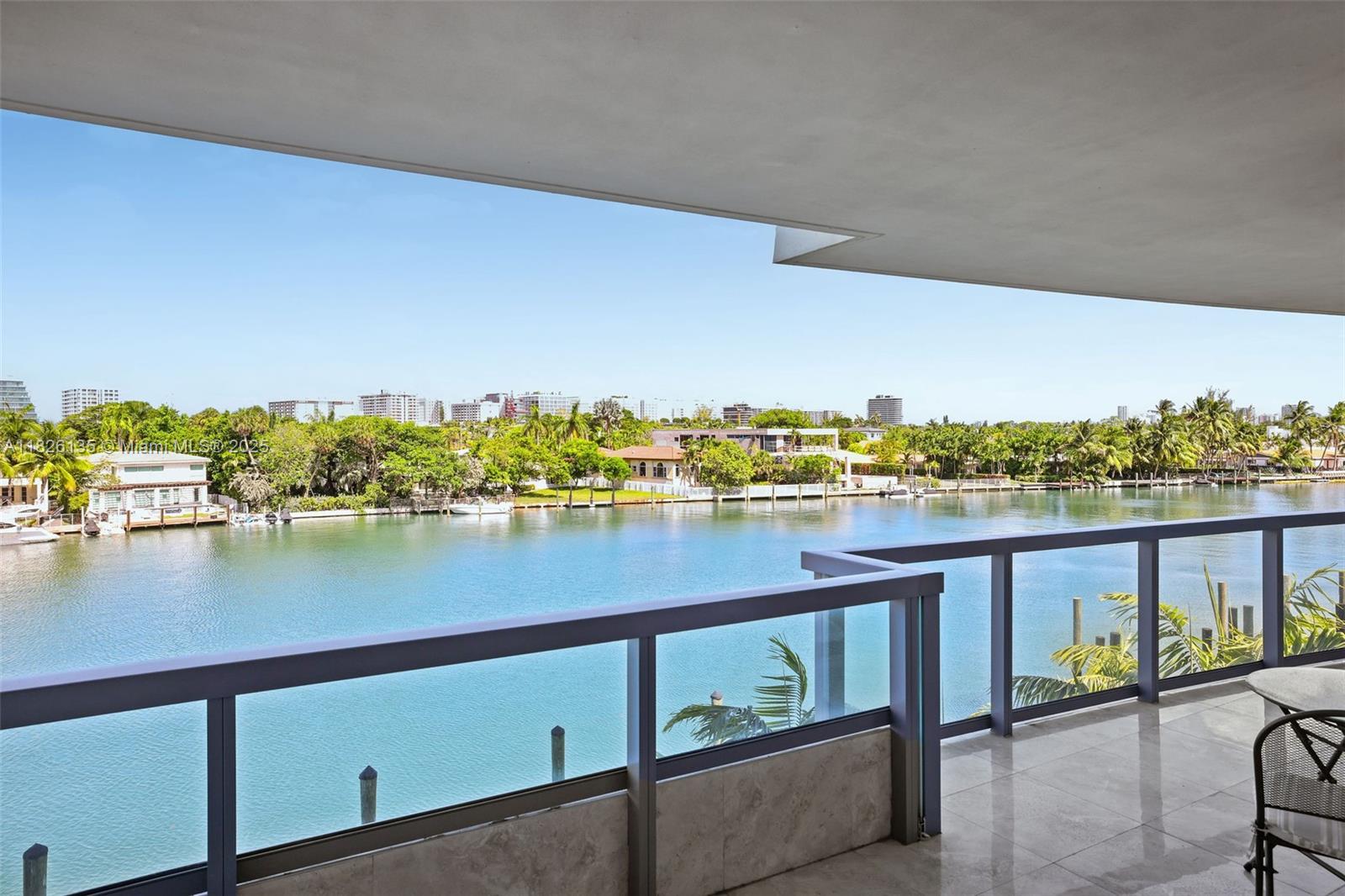 9261 East Bay Harbor Drive, Unit 404 Bay Harbor Islands, FL 33154 - Photo 12 of 49 a view of a lake from a balcony
