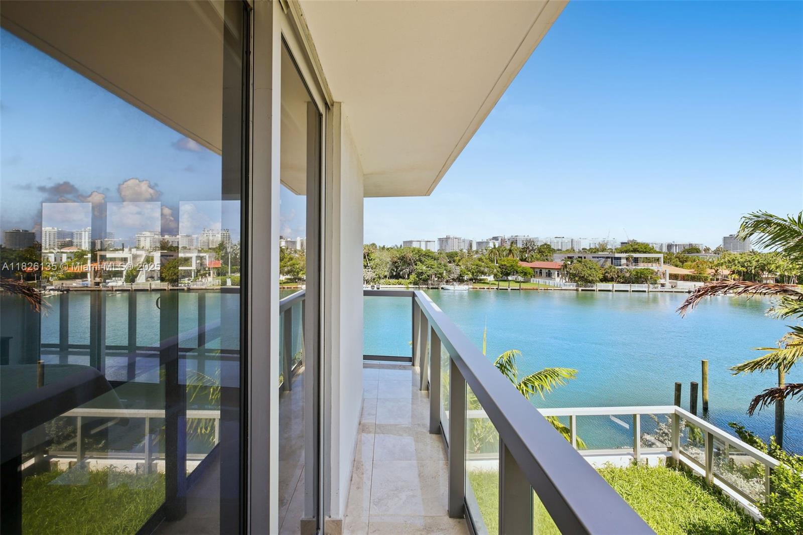 9261 East Bay Harbor Drive, Unit 404 Bay Harbor Islands, FL 33154 - Photo 20 of 49 a view of a lake from a balcony