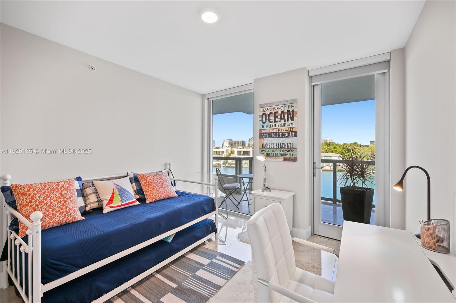 9261 East Bay Harbor Drive, Unit 404 Bay Harbor Islands, FL 33154 - Photo 33 of 49 a bedroom with furniture and a potted plant