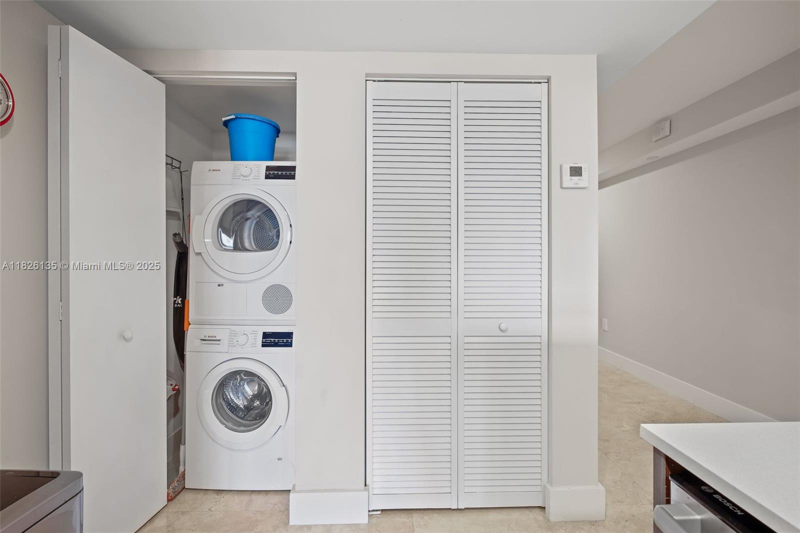 9261 East Bay Harbor Drive, Unit 404 Bay Harbor Islands, FL 33154 - Photo 37 of 49 a utility room with dryer and washer