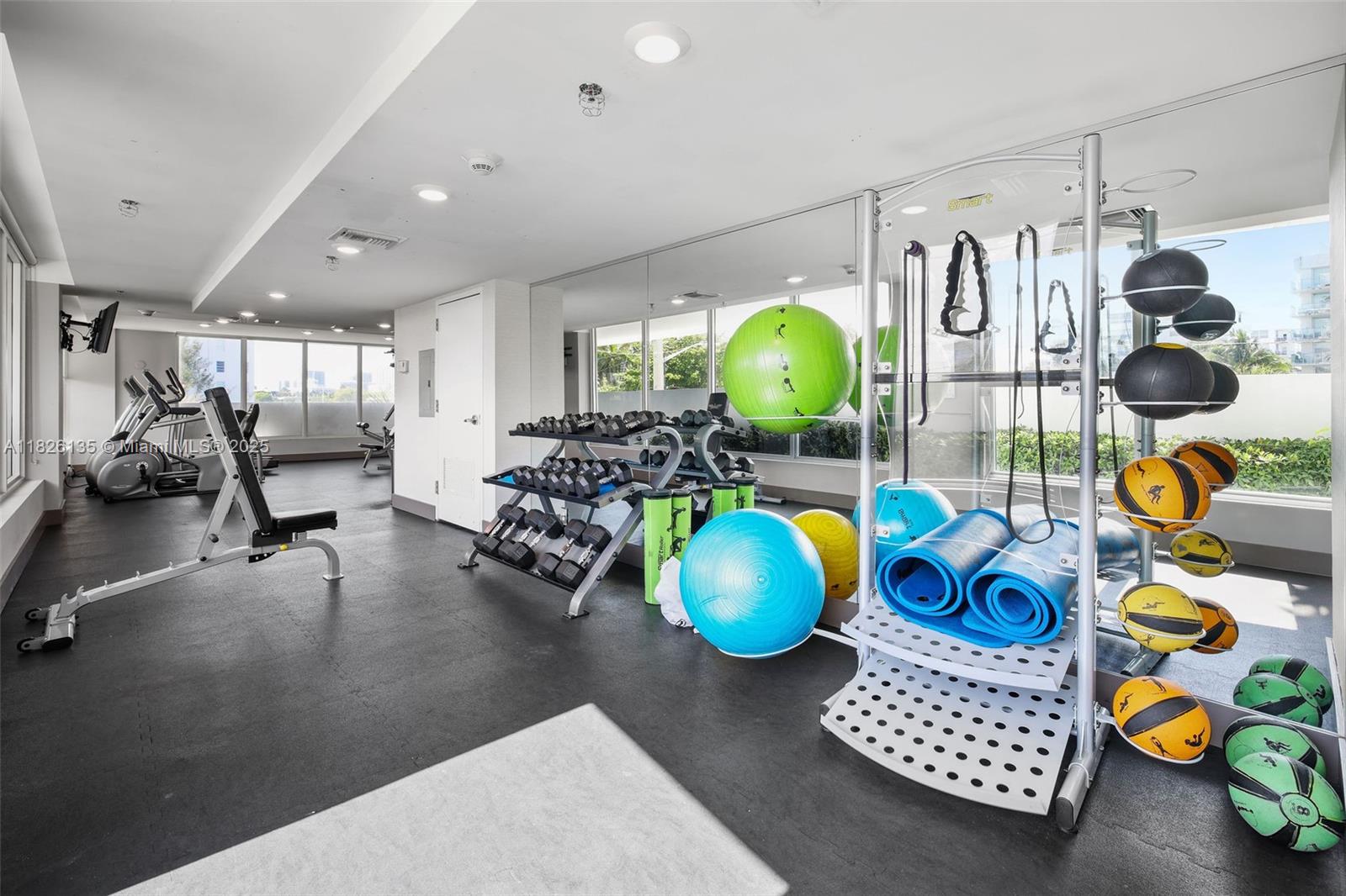 9261 East Bay Harbor Drive, Unit 404 Bay Harbor Islands, FL 33154 - Photo 38 of 49 a view of living room with furniture and gym equipment