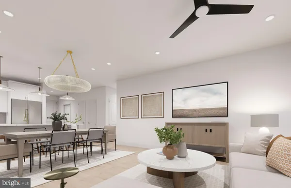 a kitchen with a white cabinets and chairs