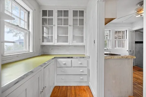 a kitchen with a refrigerator and a sink