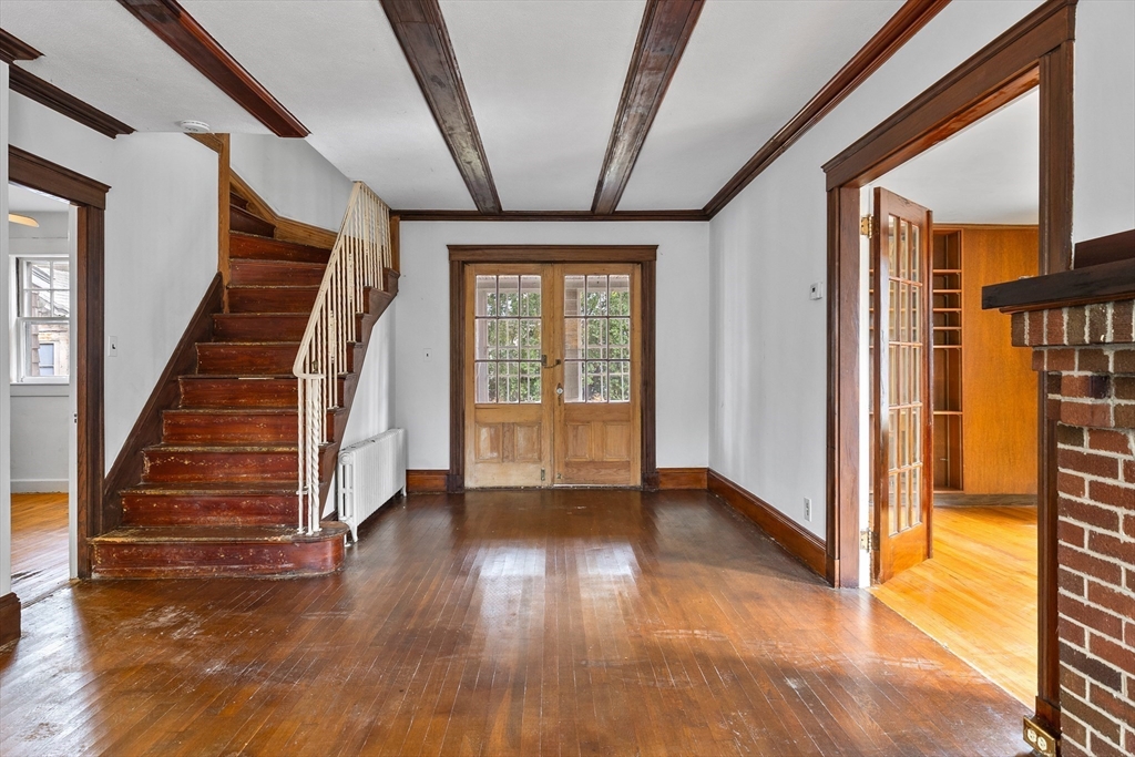 69 Horace Road Belmont, MA 02478 - Photo 13 of 27 a view of an entryway with wooden floor and door