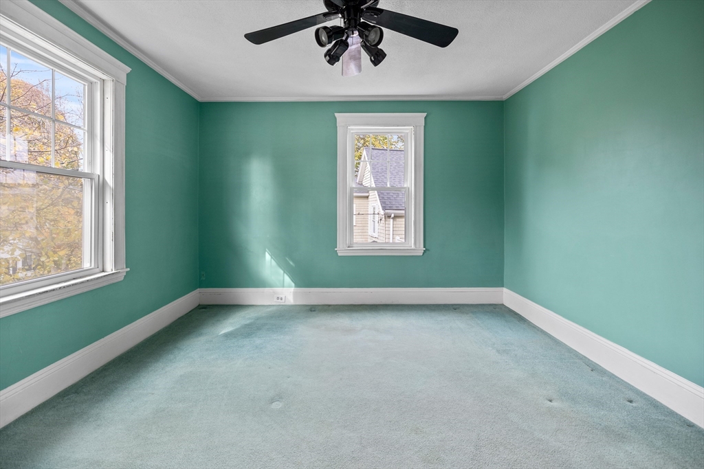69 Horace Road Belmont, MA 02478 - Photo 16 of 27 an empty room with a window and a ceiling fan