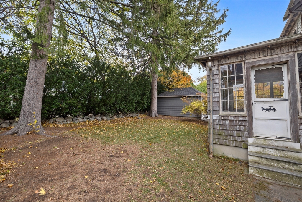 69 Horace Road Belmont, MA 02478 - Photo 24 of 27 a front view of a house with garden
