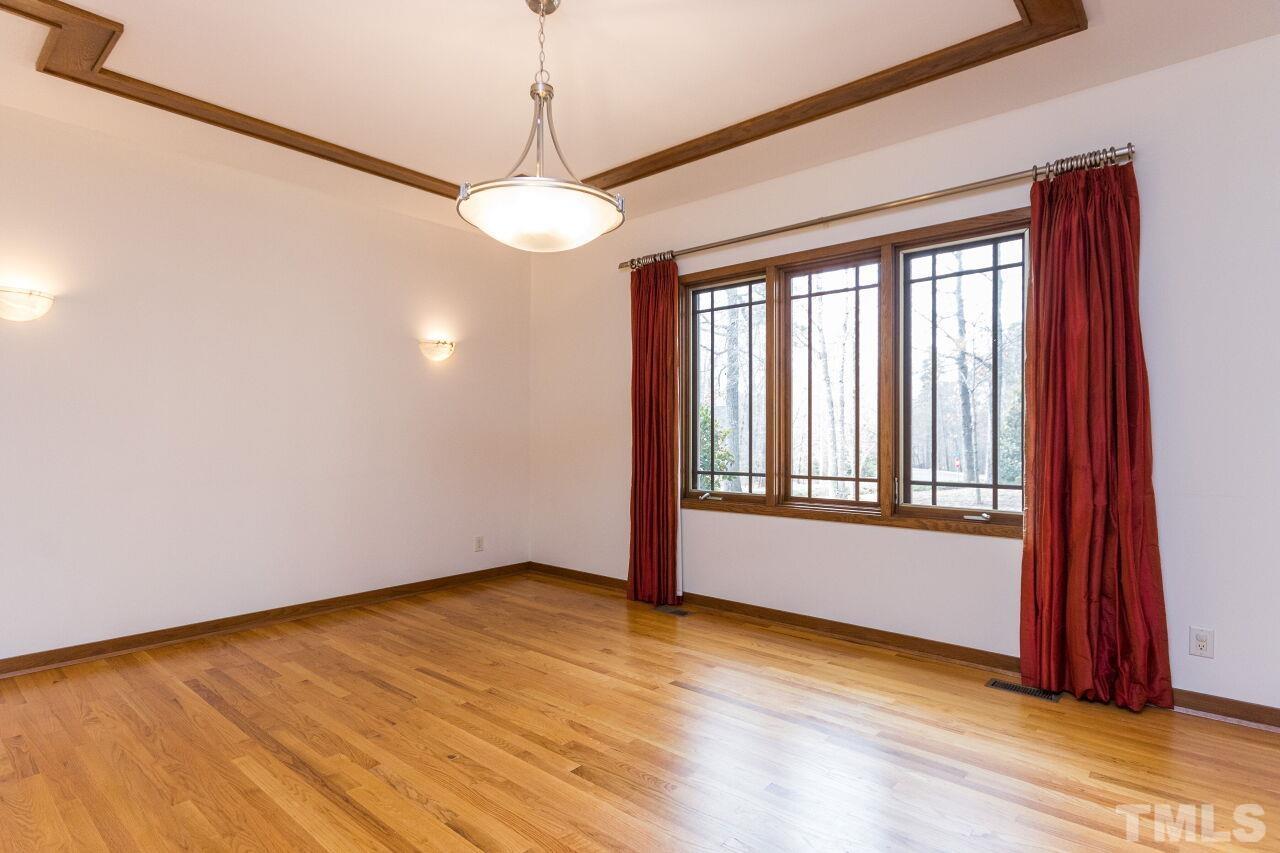 2 Pine Top Place Durham, NC 27705 - Photo 17 of 50 a view of an empty room with a window and wooden floor