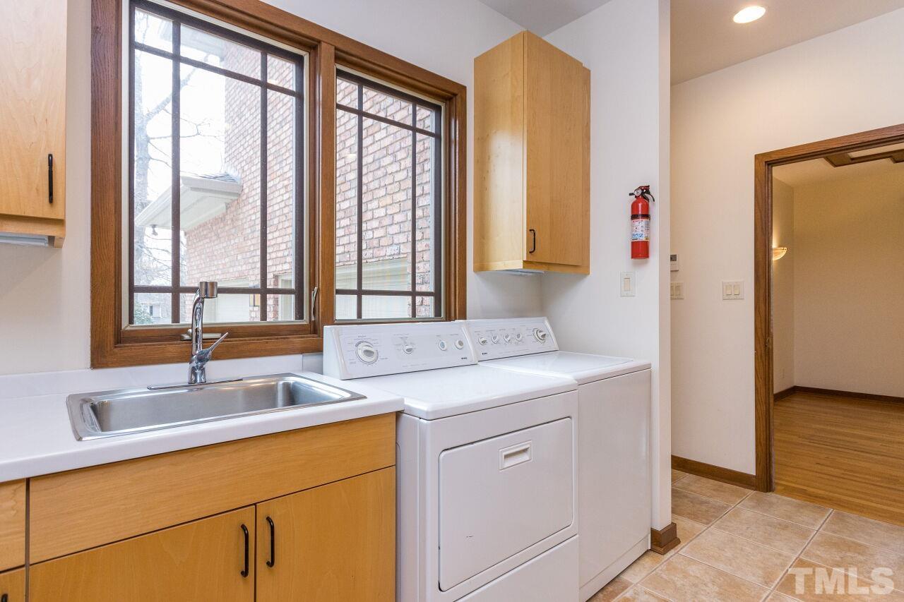 2 Pine Top Place Durham, NC 27705 - Photo 22 of 50 a bathroom with a sink and a mirror
