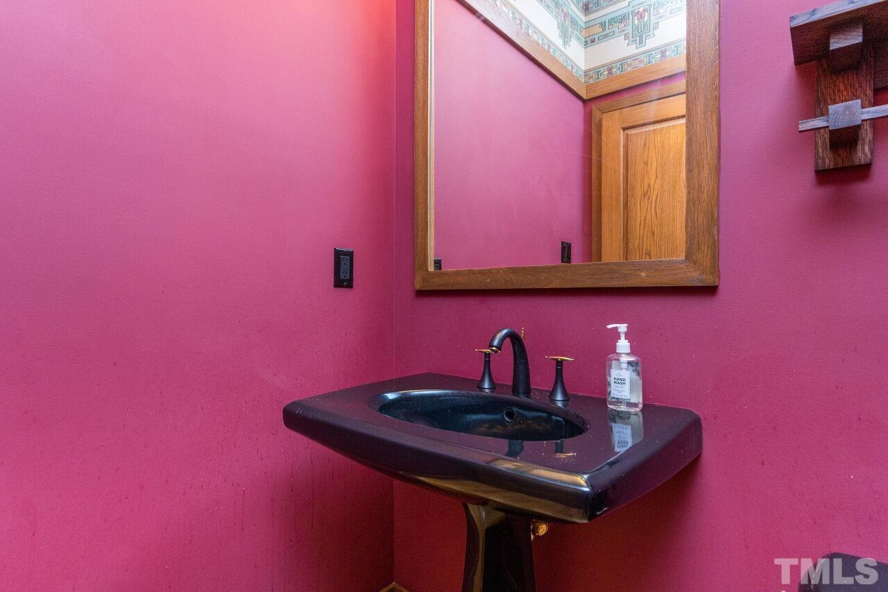 2 Pine Top Place Durham, NC 27705 - Photo 23 of 50 a bathroom with a sink and a mirror