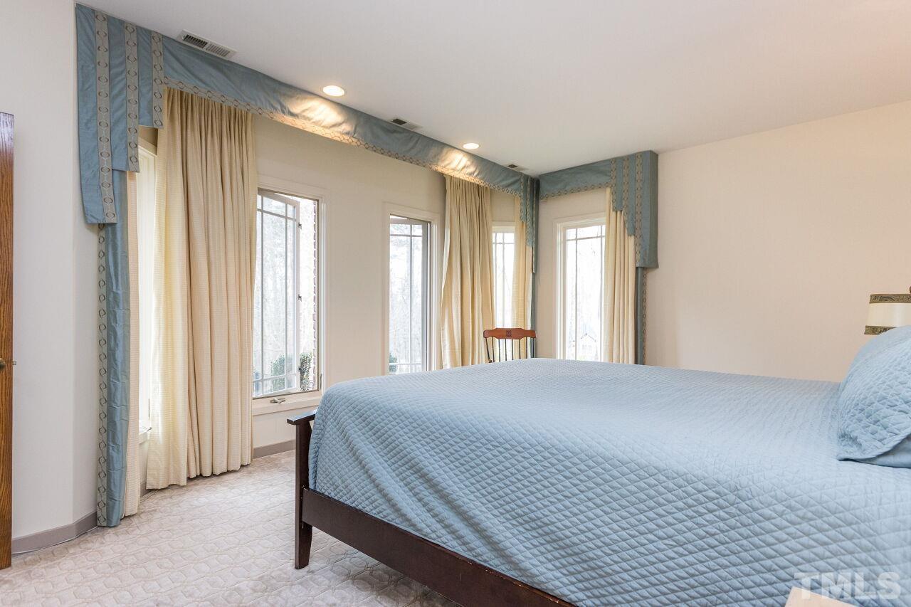 2 Pine Top Place Durham, NC 27705 - Photo 26 of 50 a spacious bedroom with a large bed and a large window