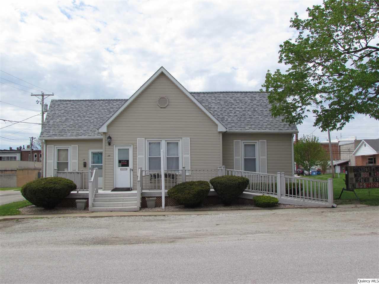 20 South Washington Street Carthage, IL 62321 - Photo 1 of 1 a front view of a house with garage and a garage