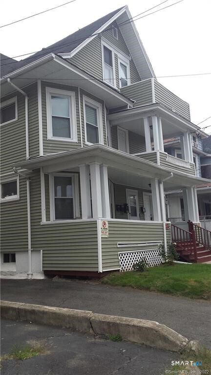 a view of a building with a yard