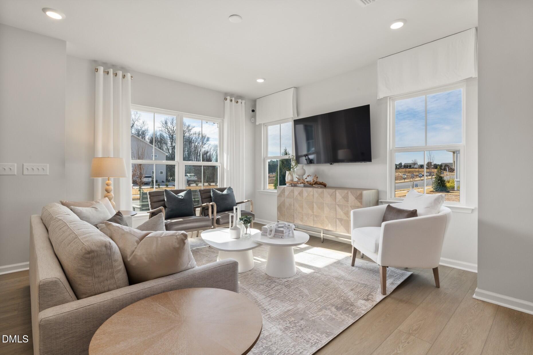 2901 Denson Road Fuquay-Varina, NC 27526 - Photo 10 of 31 a living room with furniture and a flat screen tv