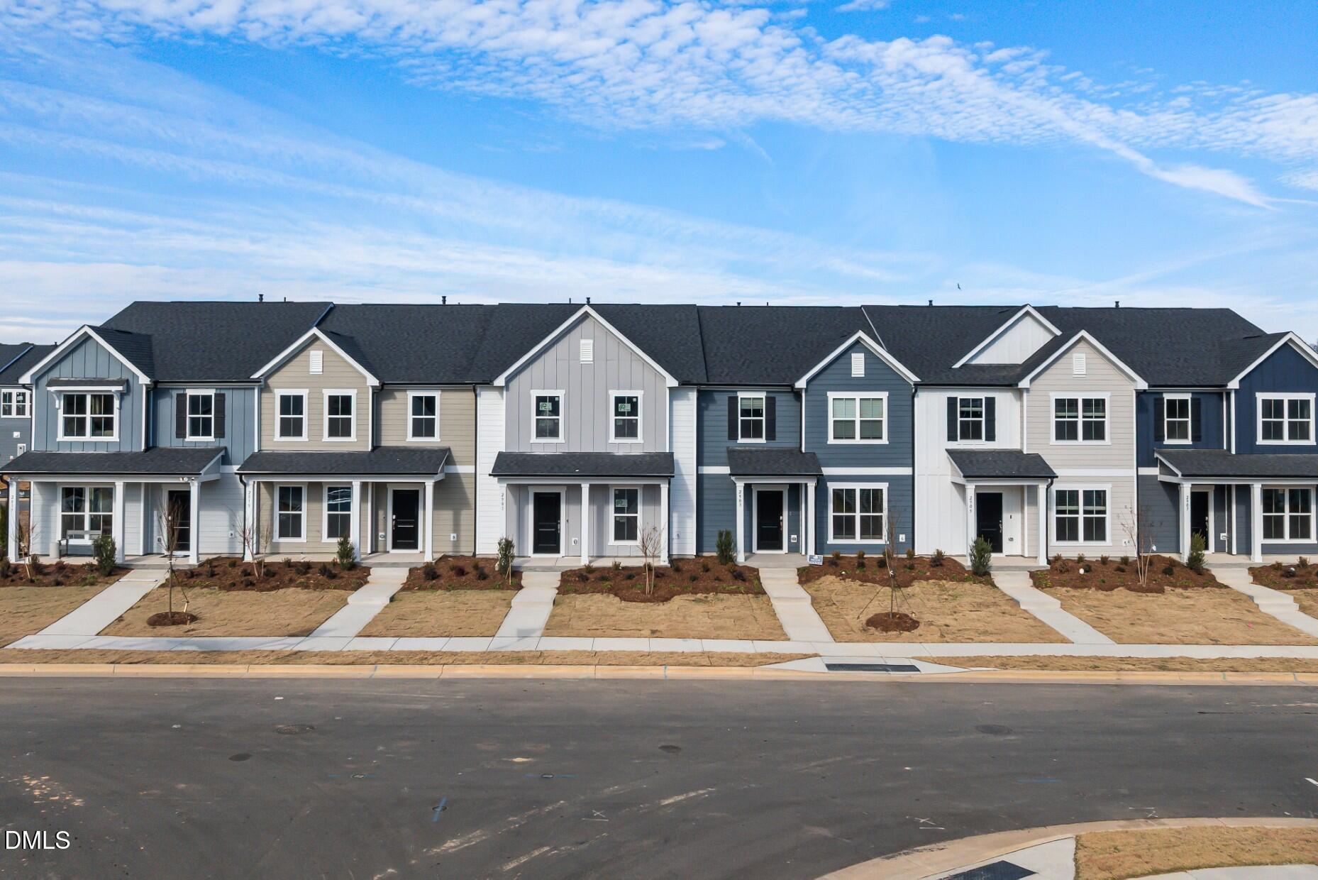 2901 Denson Road Fuquay-Varina, NC 27526 - Photo 26 of 31 a front view of a residential apartment building with parking space