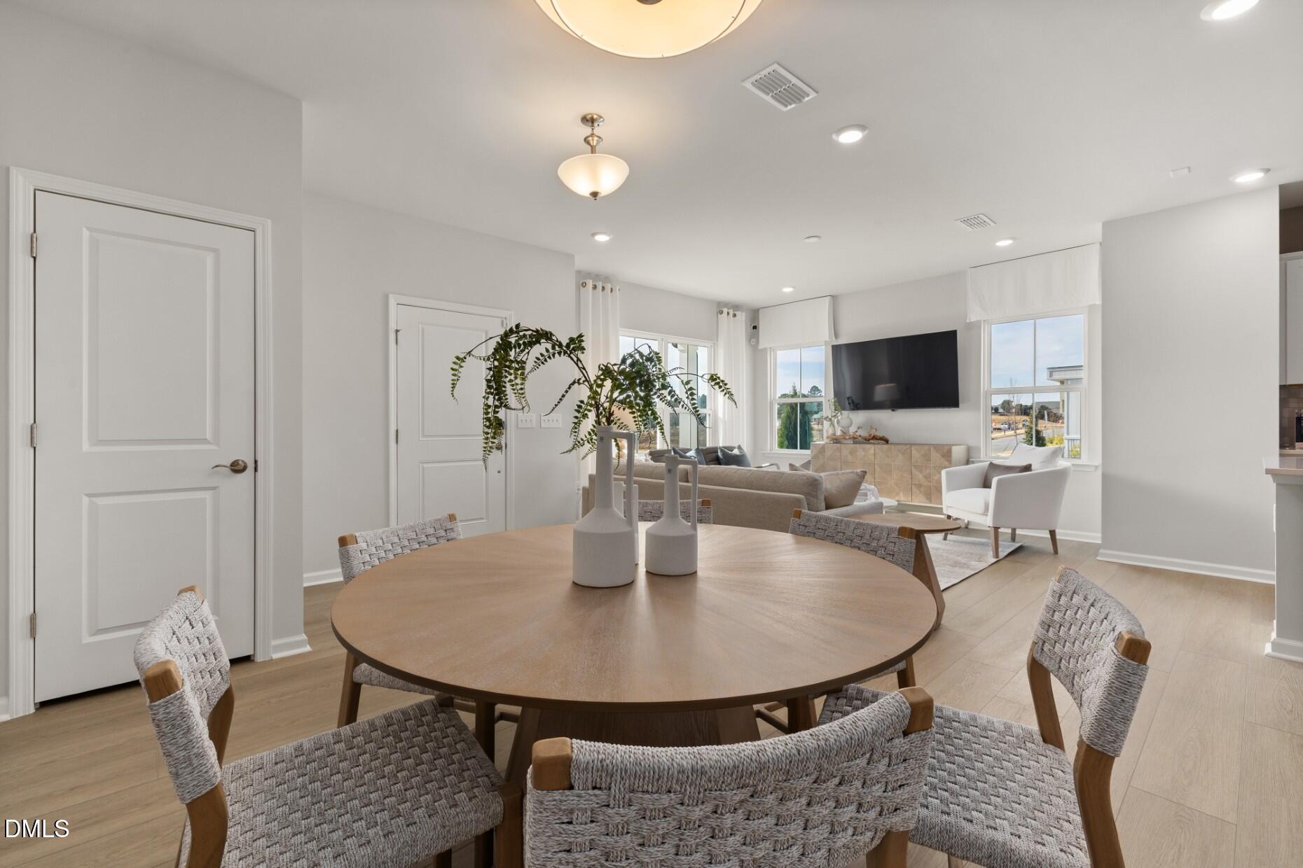 2901 Denson Road Fuquay-Varina, NC 27526 - Photo 8 of 31 a dining room with furniture and wooden floor