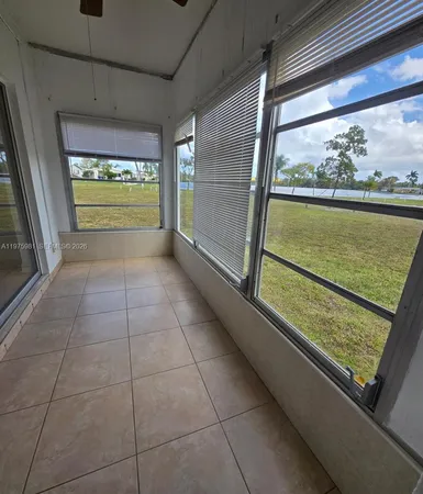 a view of an empty room and a window