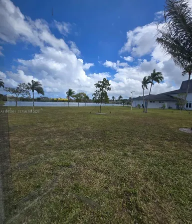 a view of a lake with a big yard
