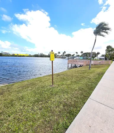 a view of a lake with a yard
