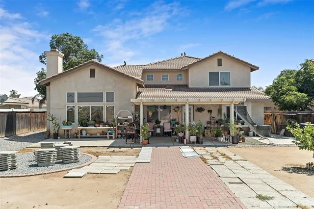 a view of house with yard