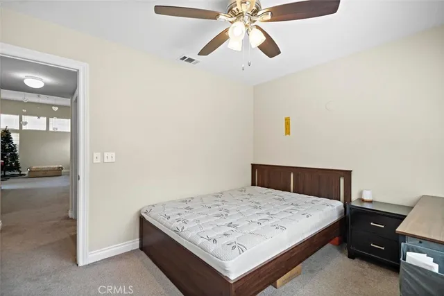 a bedroom that has a bed and a table in it