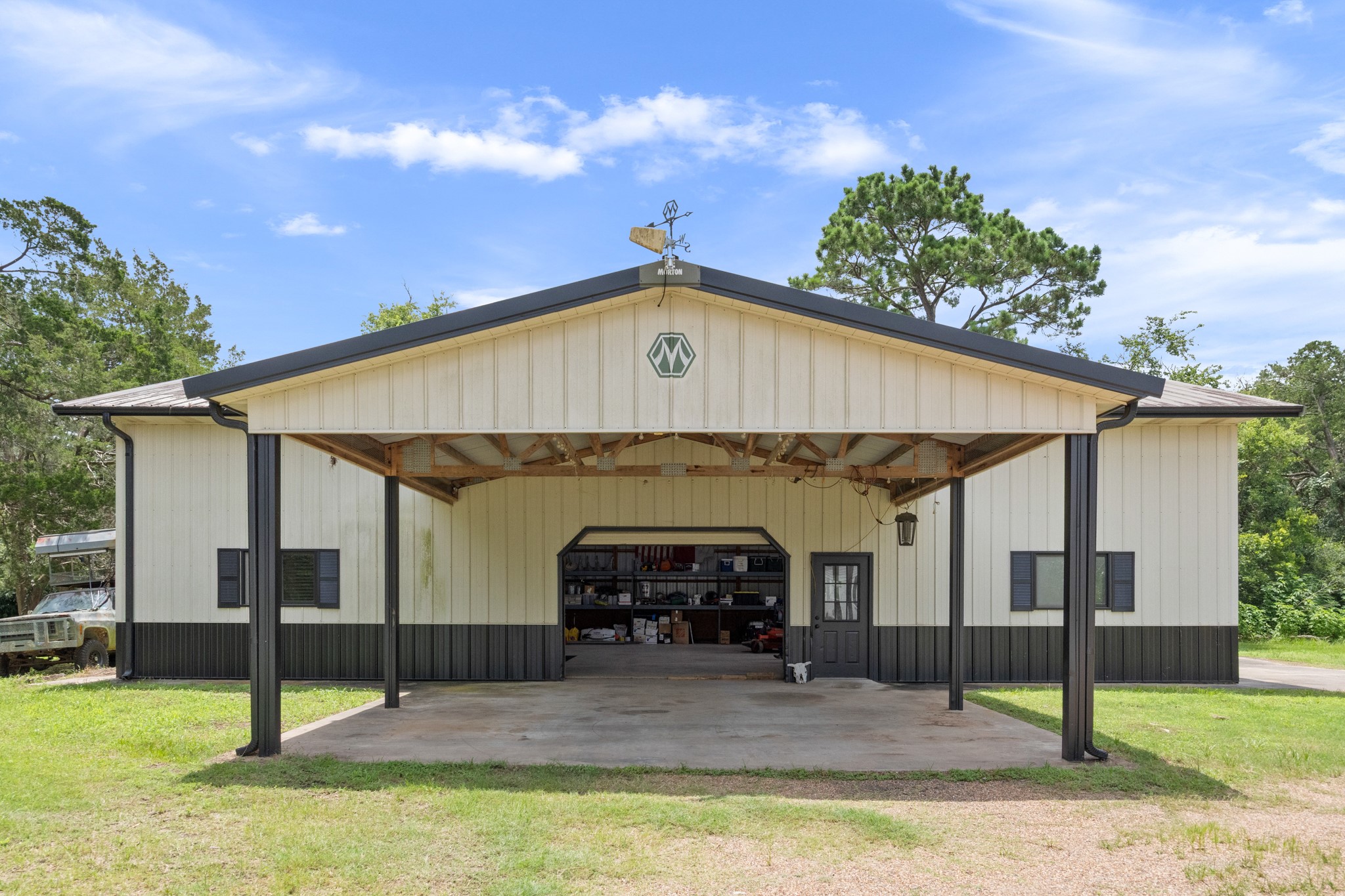 10209 Oberrender Road Needville, TX 77461 - Photo 36 of 50 15X15 covered Carport greets you as you approach this 40X60 Morton Built Workshop!