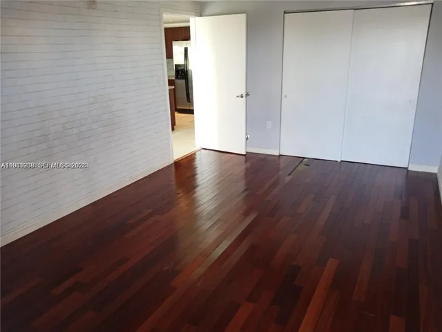 a view of a small space with wooden floor