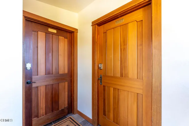 a kitchen with stainless steel appliances granite countertop a sink dishwasher stove and cabinets with wooden floor