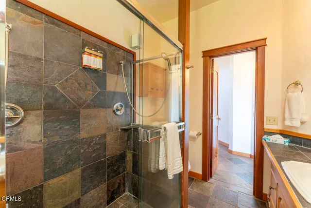 a bedroom with a large bed and a dresser