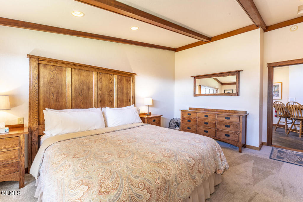 44920 Little Lake Road Mendocino, CA 95460 - Photo 17 of 62 a bedroom with a large bed and a dresser