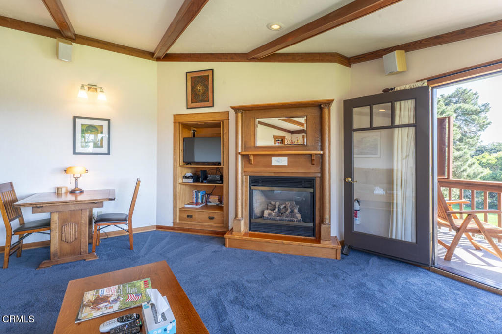 44920 Little Lake Road Mendocino, CA 95460 - Photo 19 of 62 a living room with furniture and a fireplace