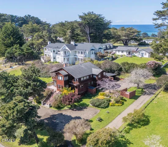 an aerial view of a house with a garden