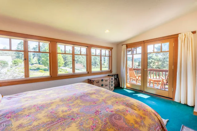a kitchen with a sink a stove and cabinets
