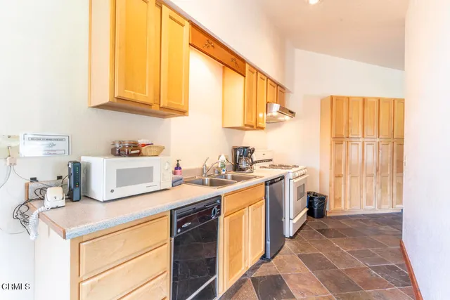 a dining room with furniture and windows