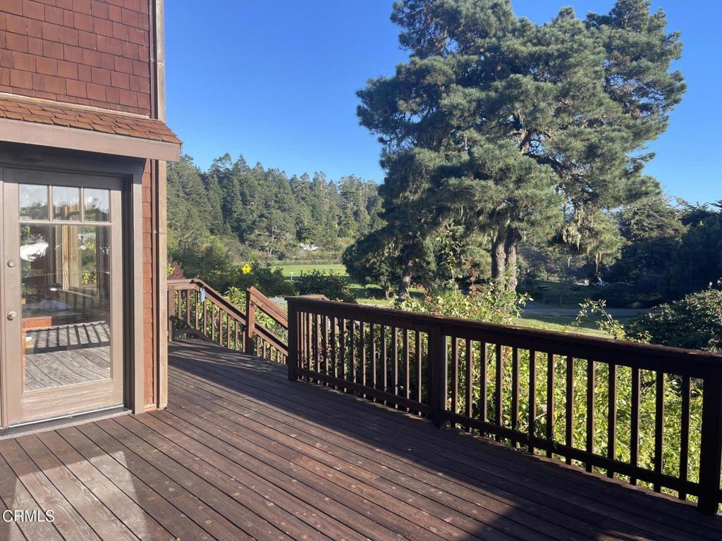 44920 Little Lake Road Mendocino, CA 95460 - Photo 40 of 62 a balcony with wooden floor and fence