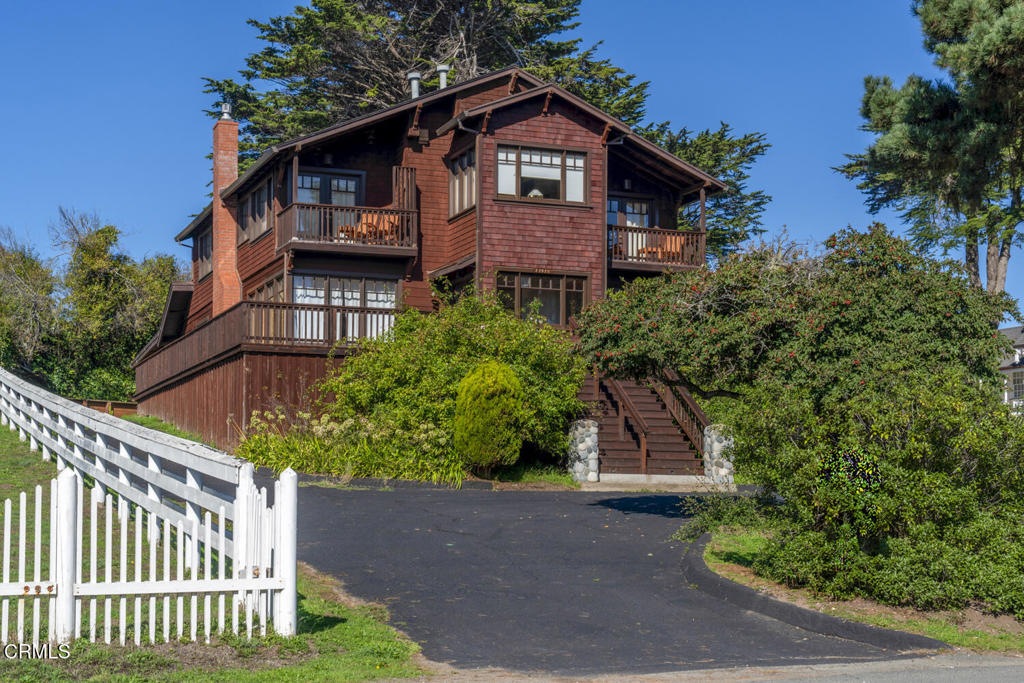 44920 Little Lake Road Mendocino, CA 95460 - Photo 4 of 62 a front view of a house with a yard and plants