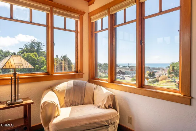 a view of a dining room with furniture wooden floor and chandelier