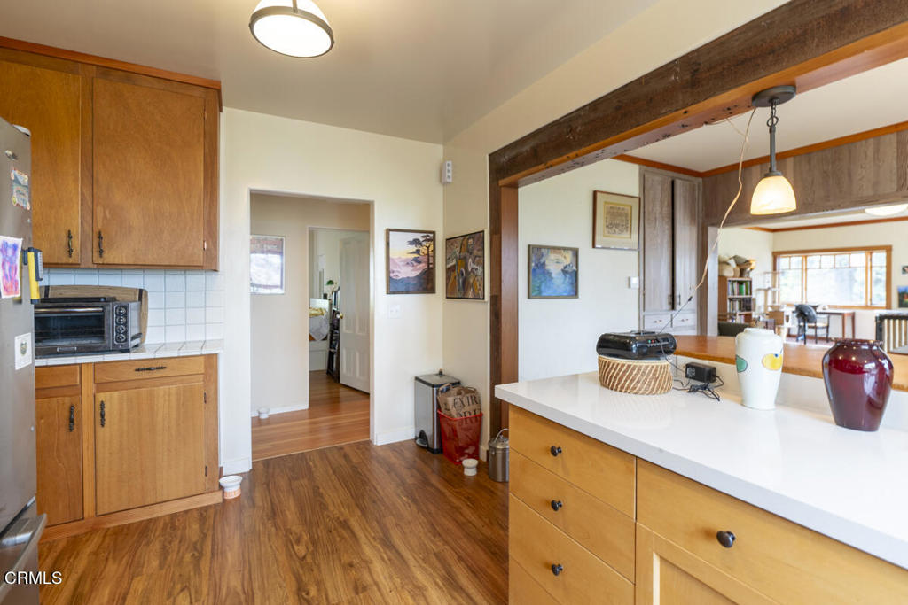 44920 Little Lake Road Mendocino, CA 95460 - Photo 47 of 62 a open kitchen with cabinets a sink and wooden floor