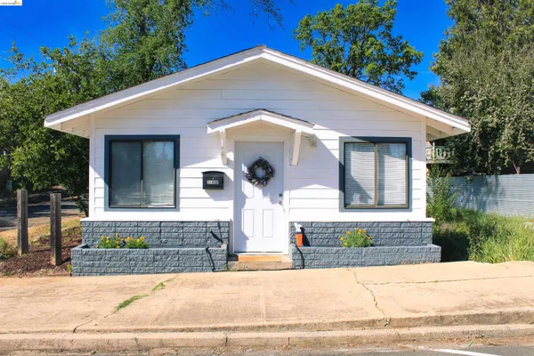 a front view of a house with garage