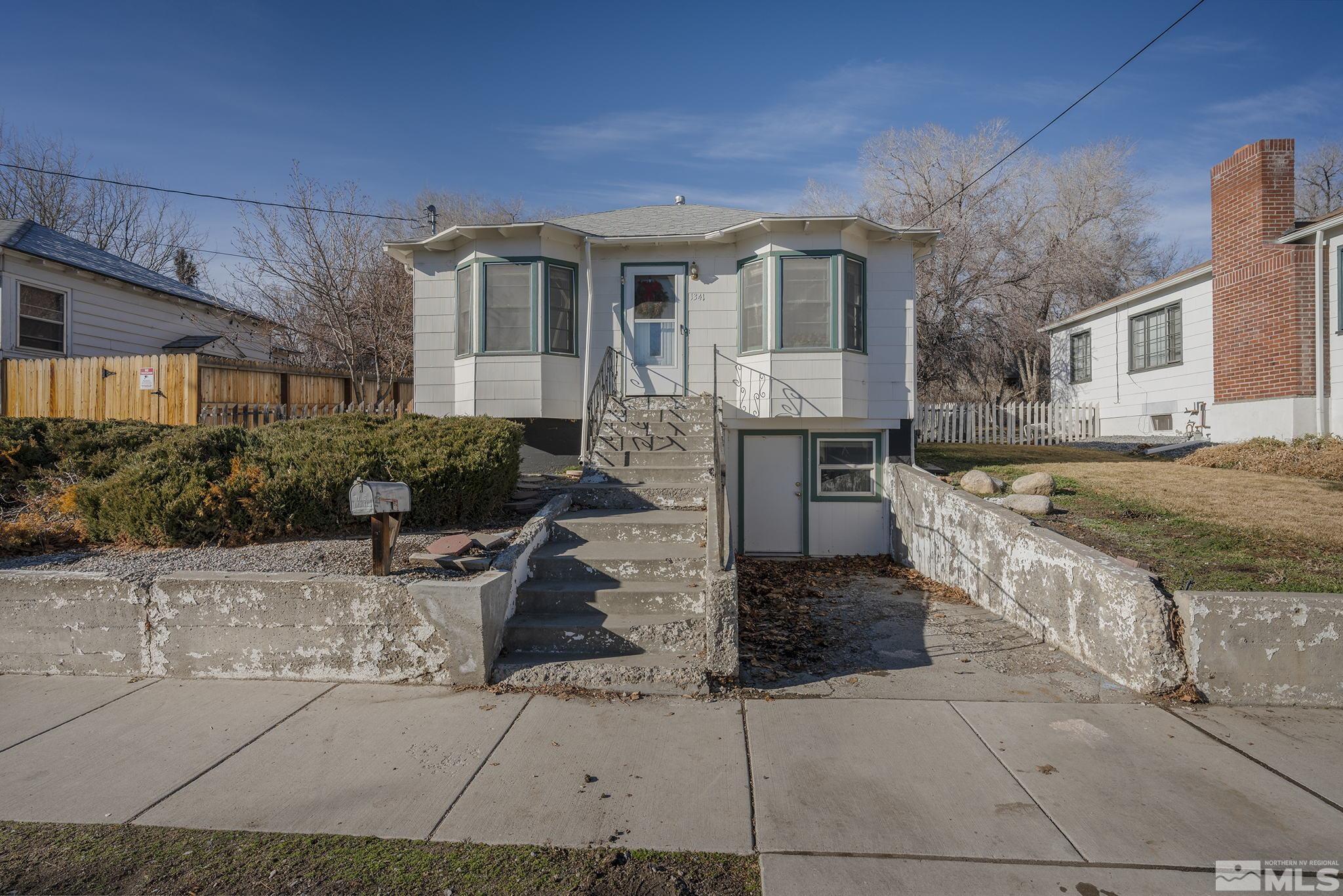 1341 Faland Way Reno, NV 89503 - Photo 1 of 16 a front view of a house with a yard