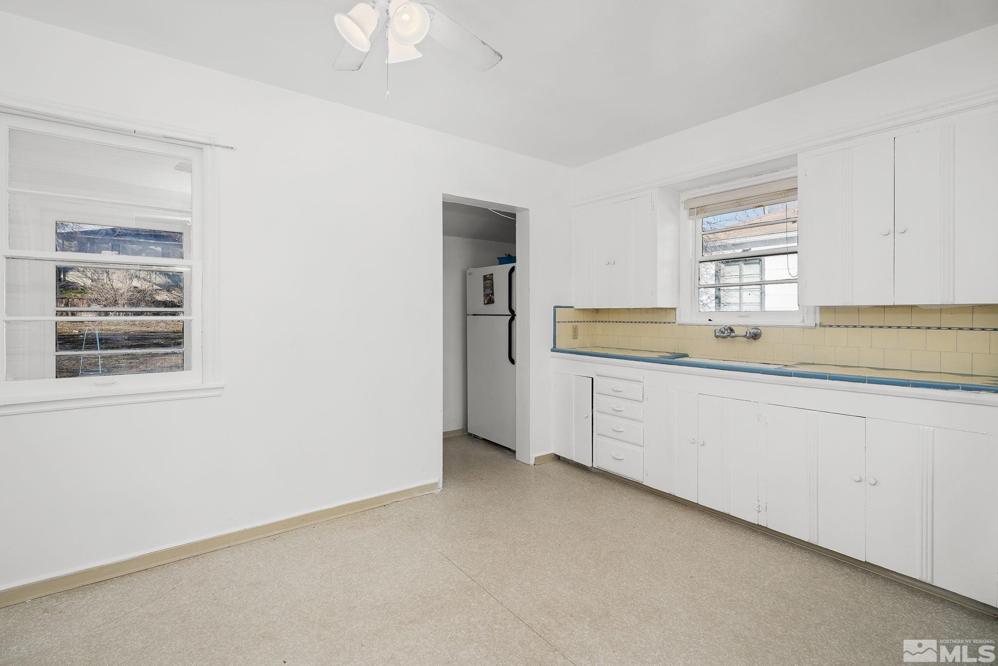 1341 Faland Way Reno, NV 89503 - Photo 7 of 16 a utility room with cabinets washer and dryer