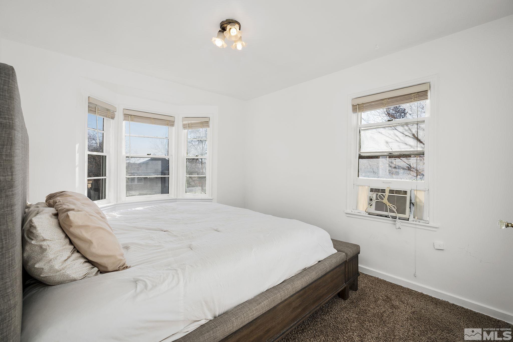 1341 Faland Way Reno, NV 89503 - Photo 9 of 16 a bedroom with a bed and a window